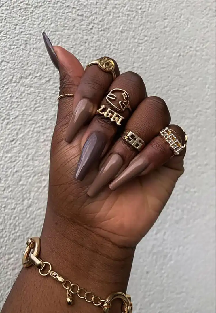 Manicure showcasing various shades of brown on each nail, complementing dark skin tones beautifully, featured in The Best Nail Designs for Dark Skin Women - Brown Acrylic Nails