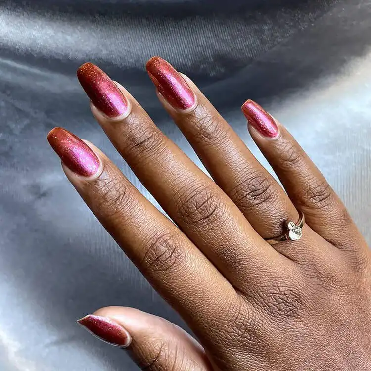 Simple and elegant solid color nails on dark skin, representing a minimalist option in The Best Nail Designs for Dark Skin Women - Brown Acrylic Nails