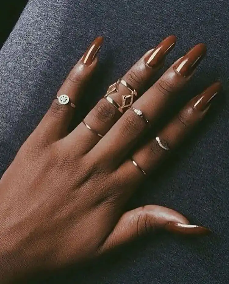 Monochromatic all brown acrylic nails on dark skin, showcasing rich tones and a perfect example of Brown Acrylic Nails from The Best Nail Designs for Dark Skin Women