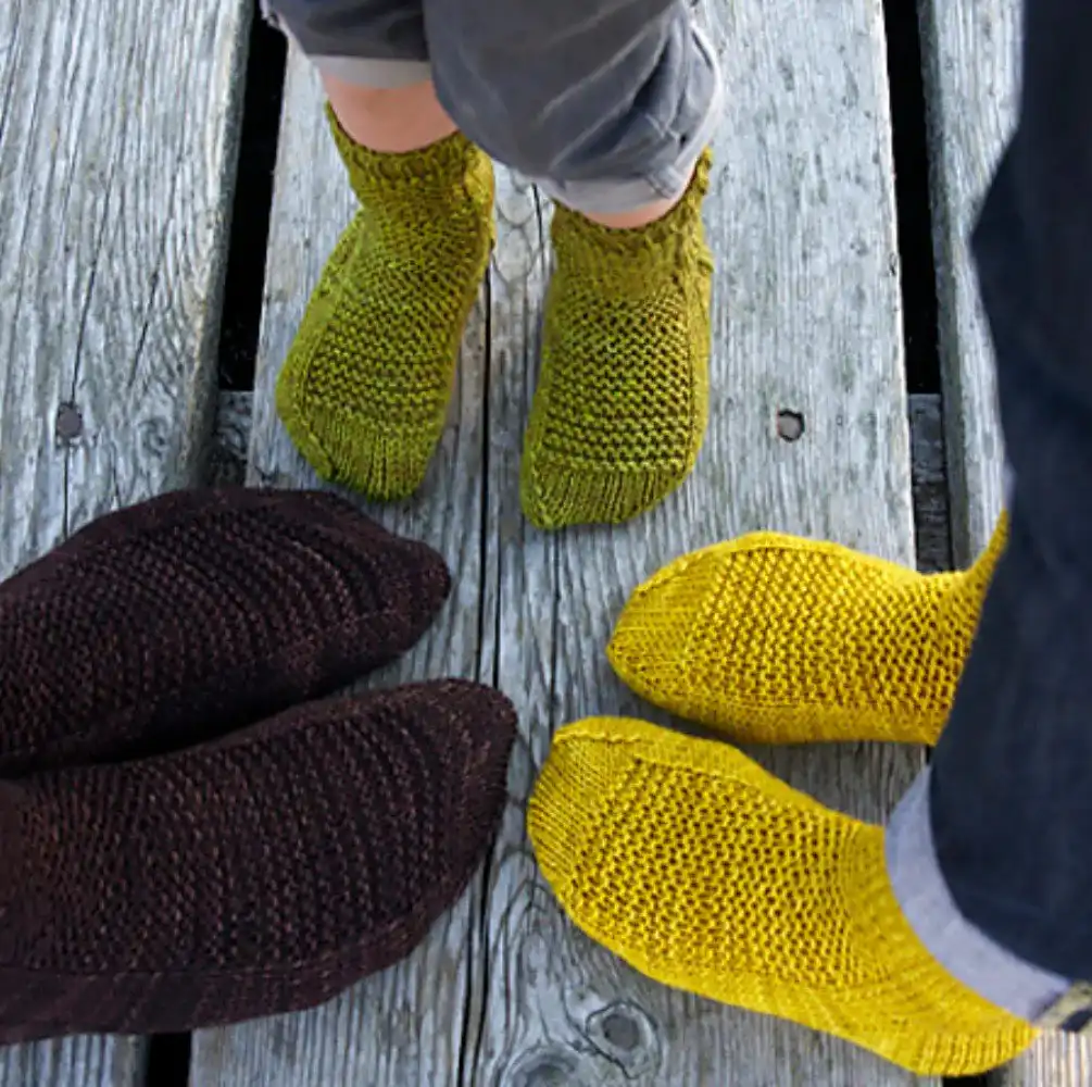 Detailed view of elegant cable knit socks, showcasing intricate textured patterns, from the Top 10 Free Knitted Socks Patterns collection.
