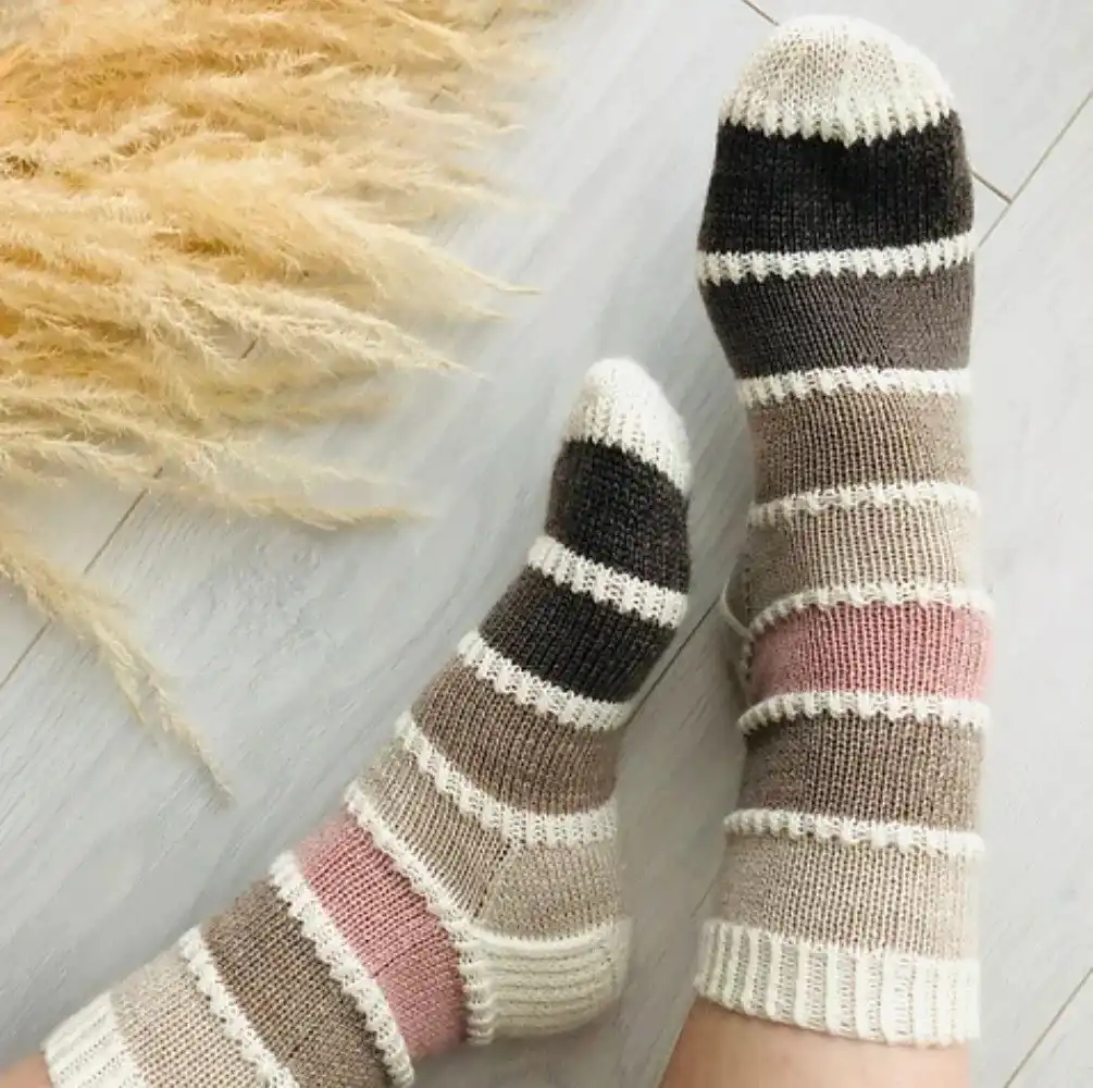 Delicate lace ankle socks in a pastel shade, featuring a beautiful openwork pattern, from the Top 10 Free Knitted Socks Patterns.
