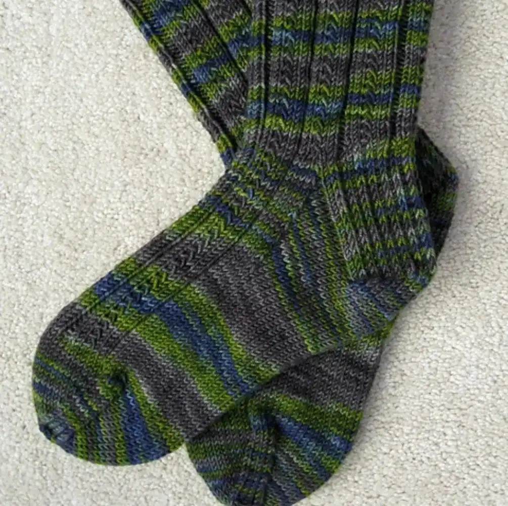 Plush Fisherman's Rib boot socks in a natural wool color, emphasizing their thick, cozy texture, from the Top 10 Free Knitted Socks Patterns.