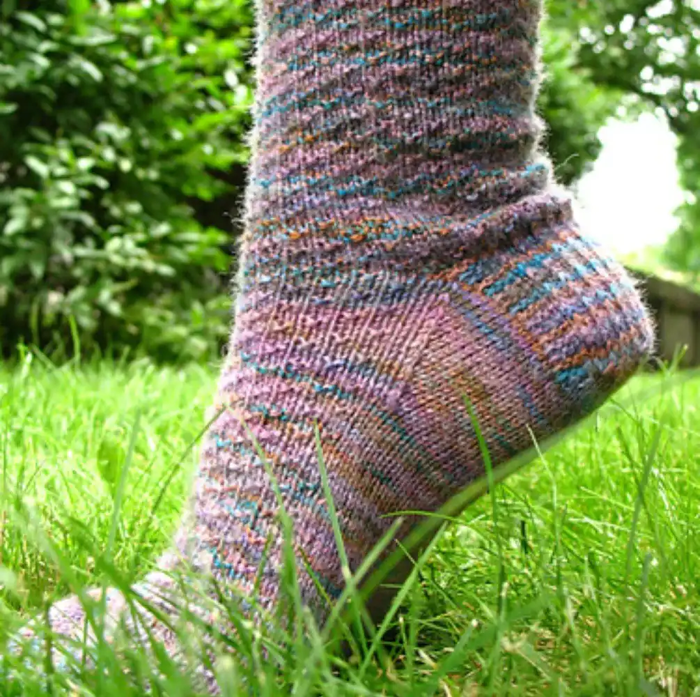 Intricate Fair Isle yoke knitted socks with a traditional colorwork pattern around the cuff, from the Top 10 Free Knitted Socks Patterns.