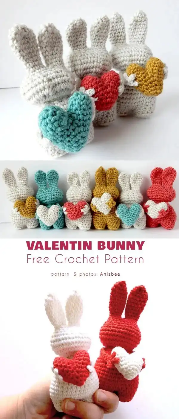 A crocheted 'Bunny Heart Amigurumi' featuring a heart shape with two bunny heads, ears, and blue bows, a unique Valentine gift.