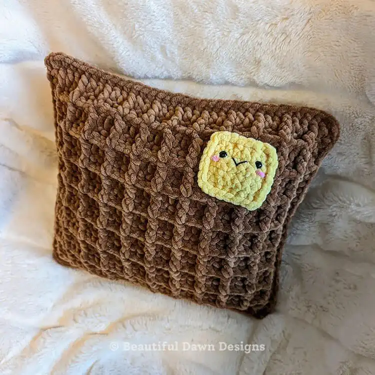 Close-up of crocheted waffle stitch texture, demonstrating the raised pattern used in the Waffle Pillow Free Crochet Pattern.