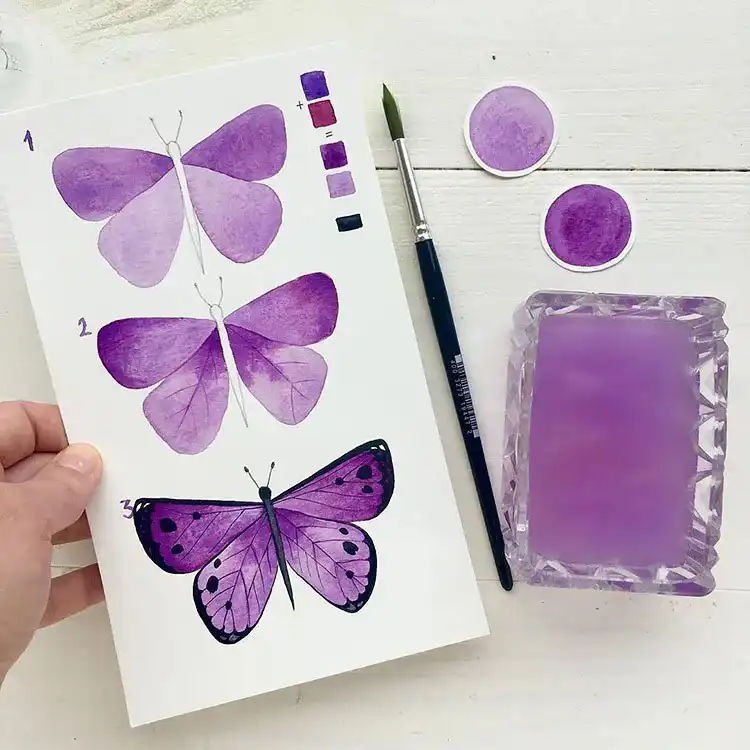 Watercolor Cherry Cheesecake Dessert Tutorial - Watercolor Painting Ideas 8 Purple watercolor butterfly with intricate wing patterns, perfect for nature painting ideas.