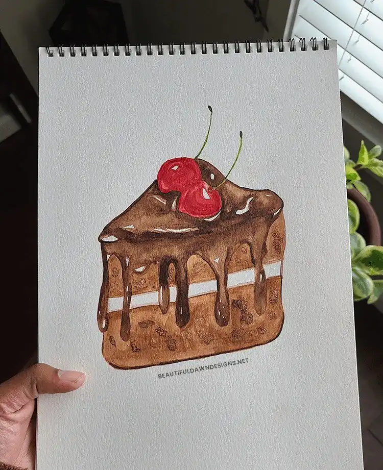 Finished watercolor painting of a chocolate cake, demonstrating how to achieve realistic textures and depth in watercolor art