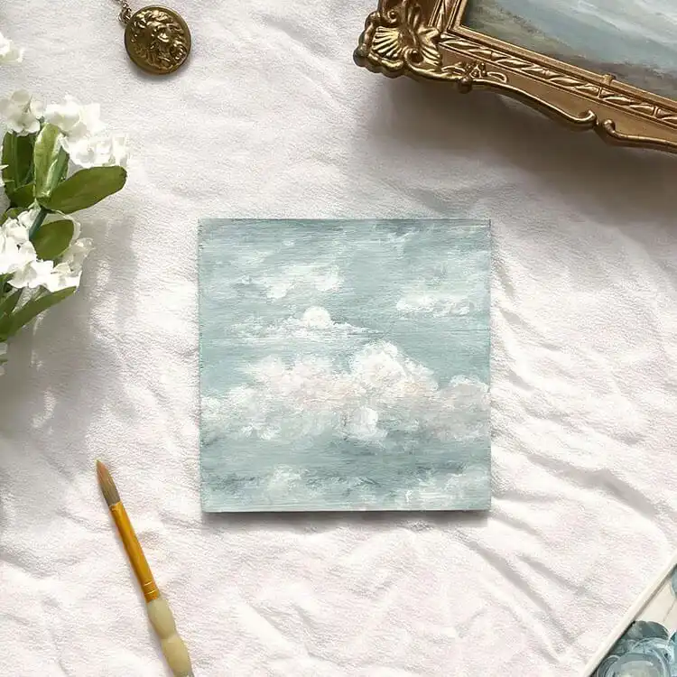 Cloud painting created with only blue and white neutral colors, emphasizing form and texture.