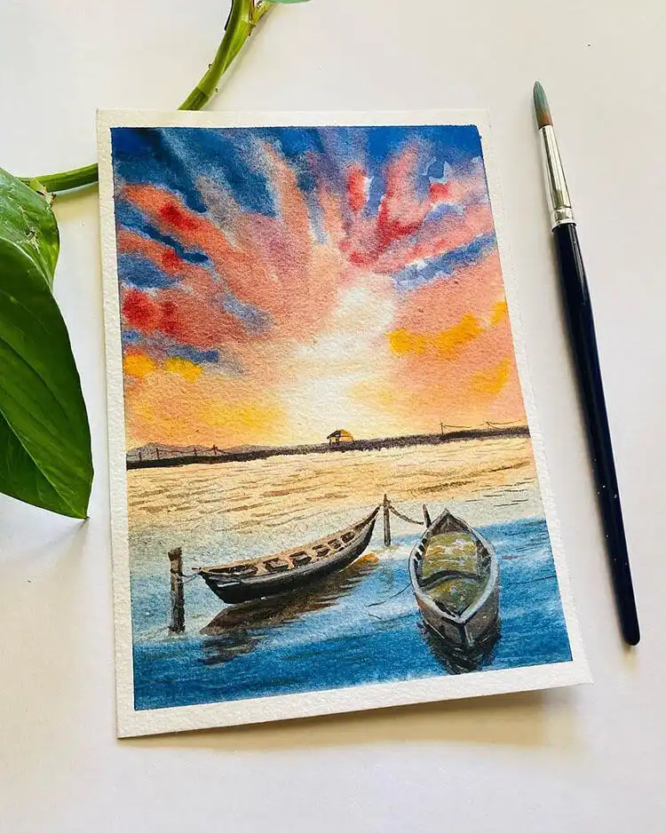 Watercolor lake scene at sunset with simple boats, capturing reflections and tranquility.