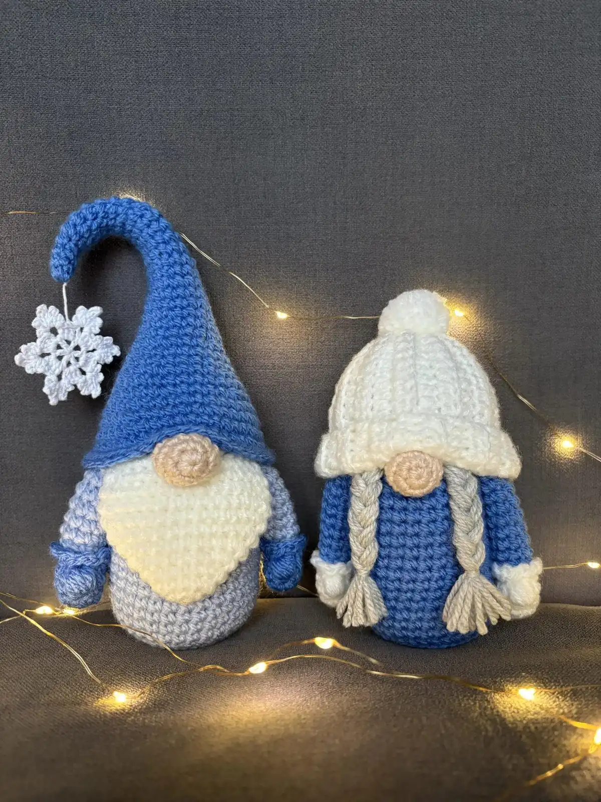 Two charming Winter Gnomes, Grandpa and Grandma, crocheted in blue and white with tall hats, perfect for cozy winter displays.