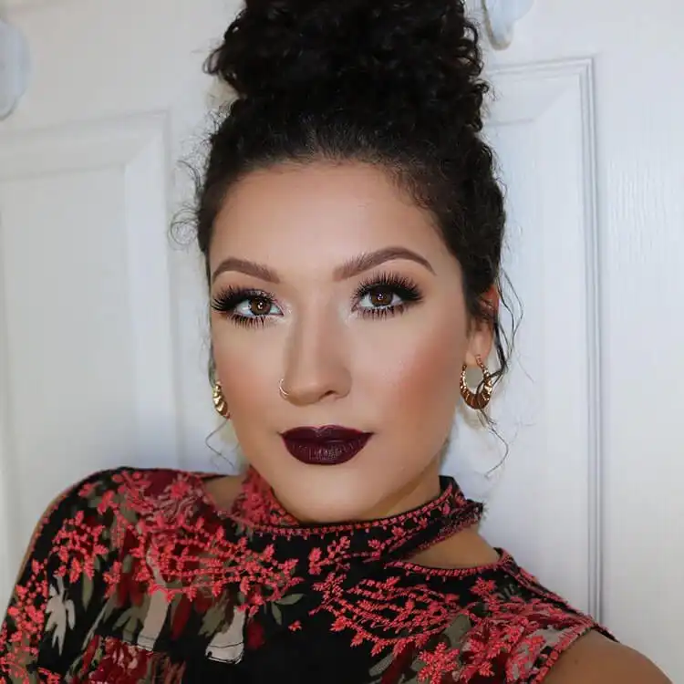 Close-up of eyes with dramatic, voluminous false eyelashes and defined eyeliner.