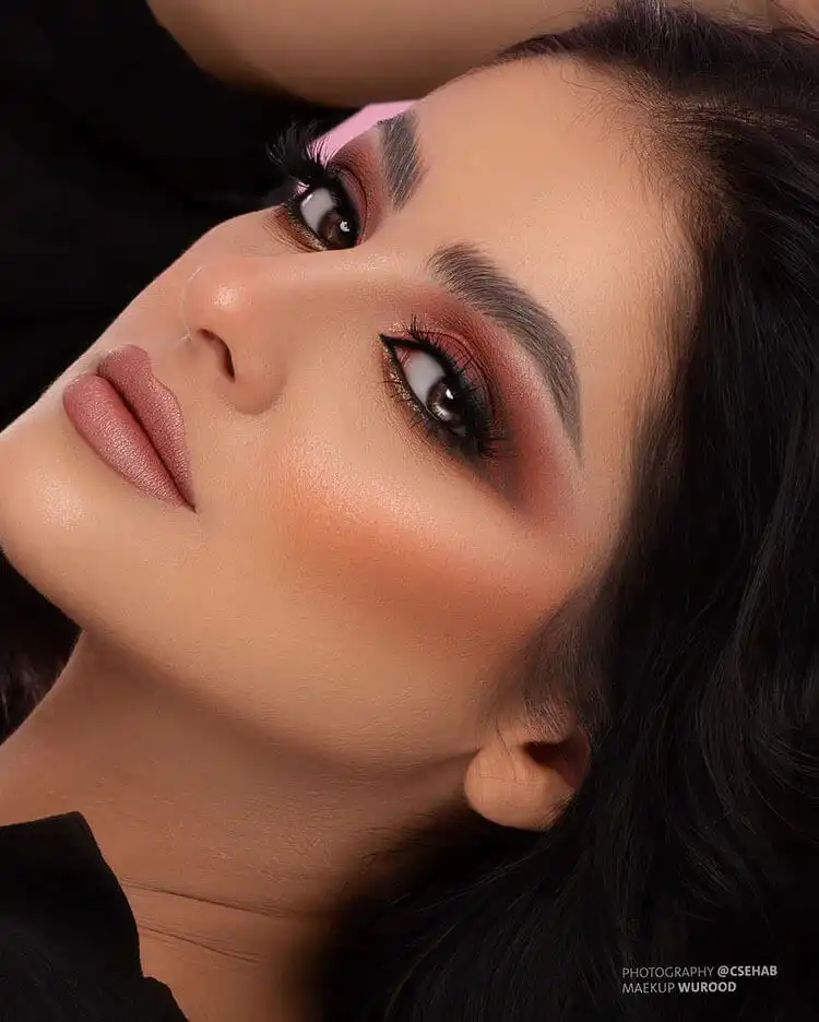 An elegant winter makeup look with a strong, defined eye and luminous skin, perfect for holiday dinners.
