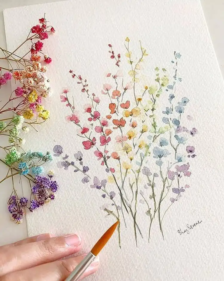 An ethereal Pastel Flowers watercolor painting, featuring soft pinks, blues, and purples in a dreamy floral composition.