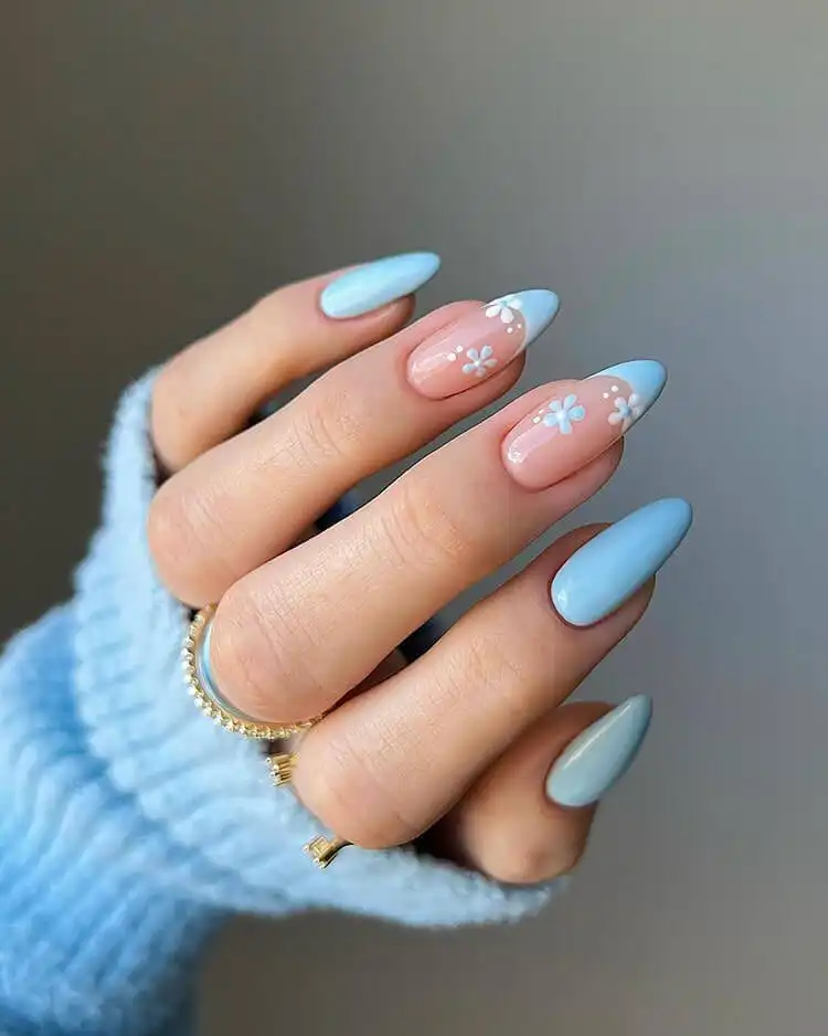 Trendy blue and white marble nails with intricate swirls, a wonderful blue nail design that is bold and classic.