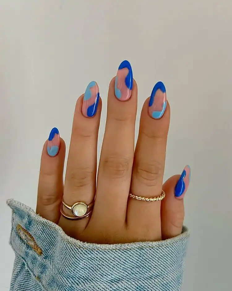 Beautiful blue butterfly nail art with intricate designs, a wonderful blue nail design that is bold and classic.