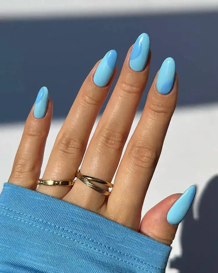Minimalist dark and light blue nail design for a modern look, a wonderful blue nail design that is bold and classic.