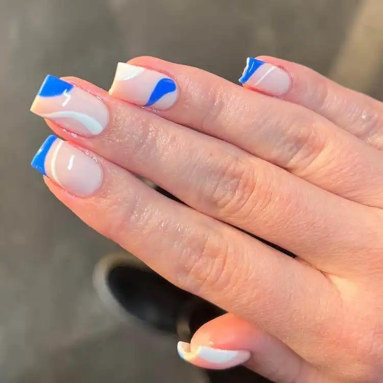 Modern blue and white square gel nails with geometric patterns, a wonderful blue nail design for a bold and classic statement.