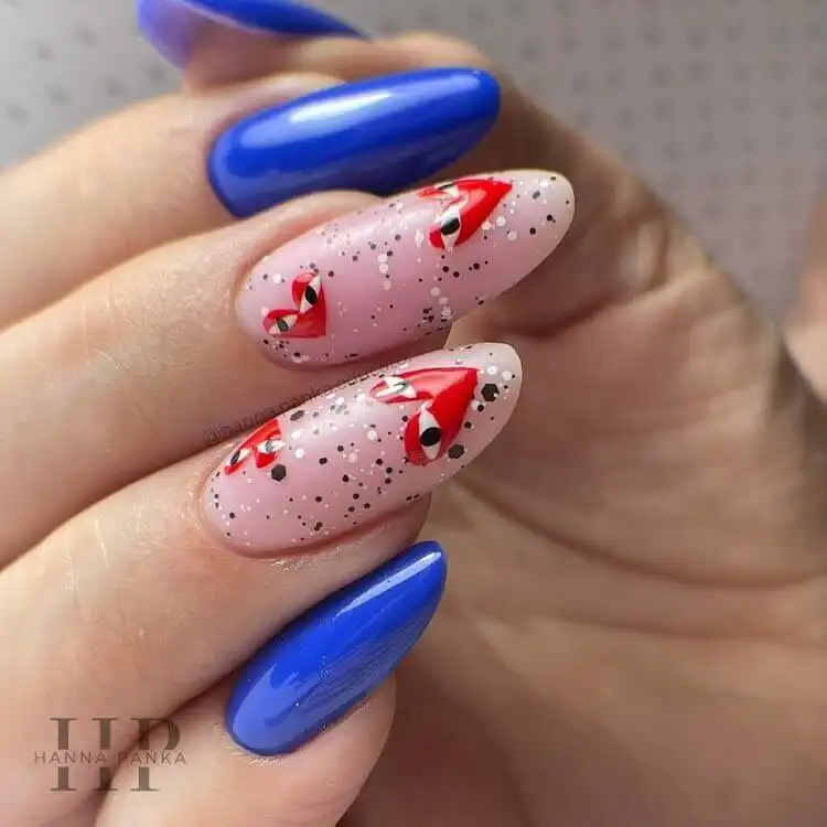 Playful Comme des Garçons heart design on blue extended gel nails, a wonderful blue nail design that is bold and classic.